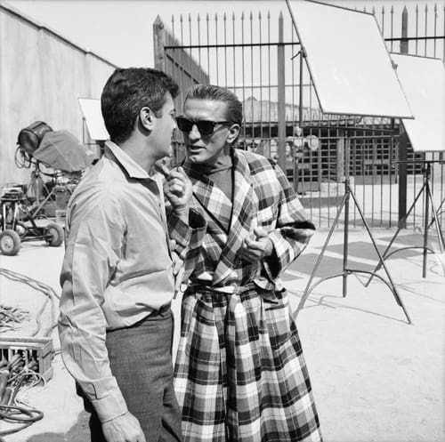 Two men talking on a movie set
