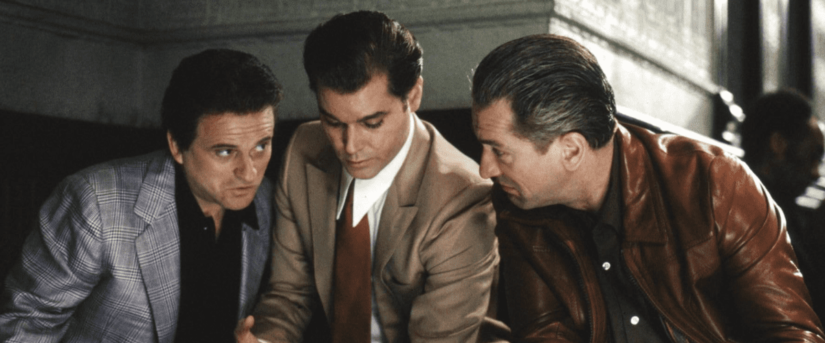 Ray Liotta, Robert De Niro, and Joe Pesci epitomize the seductive glamour and latent danger of the mob lifestyle in Martin Scorsese’s landmark crime drama Goodfellas (1990).