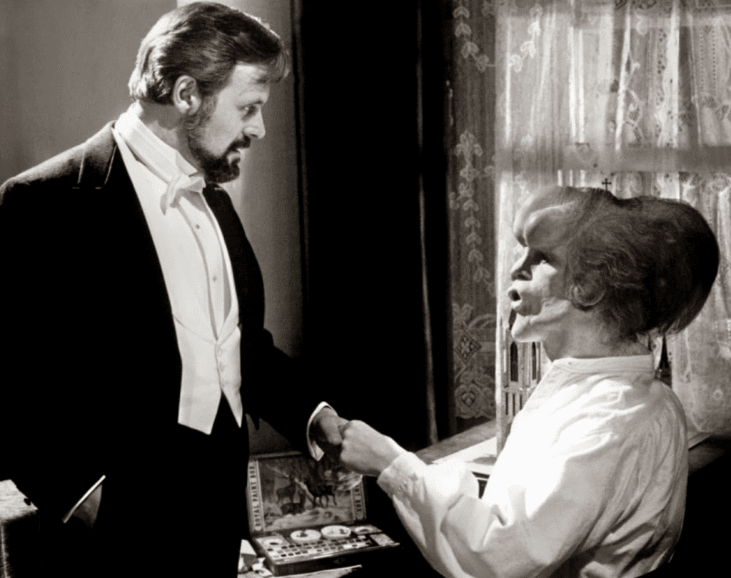 Anthony Hopkins as Frederick Treves (left) and John Hurt as John Merrick (right) in David Lynch's The Elephant Man (1980).